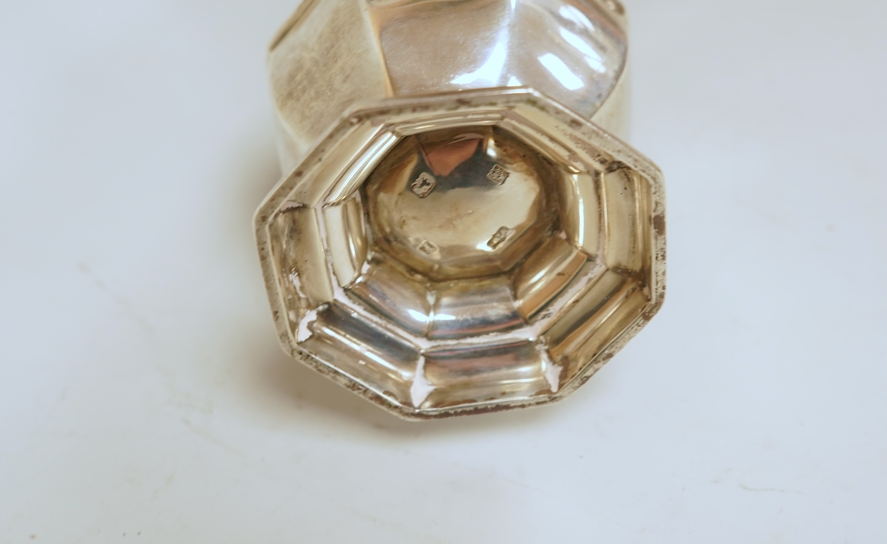 A George V silver octagonal silver sugar caster, by Mappin & Webb, Birmingham, 1930, height 16.7cm, 4.4oz.
